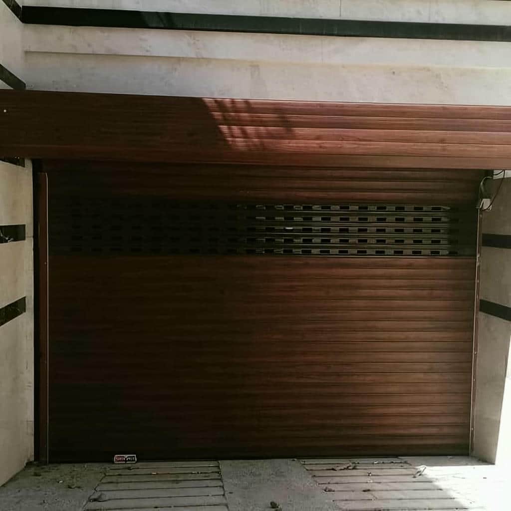 تعمیر درب کرکره ای پارکینگ اتوماتیک و تنظیم موتور در اصفهان